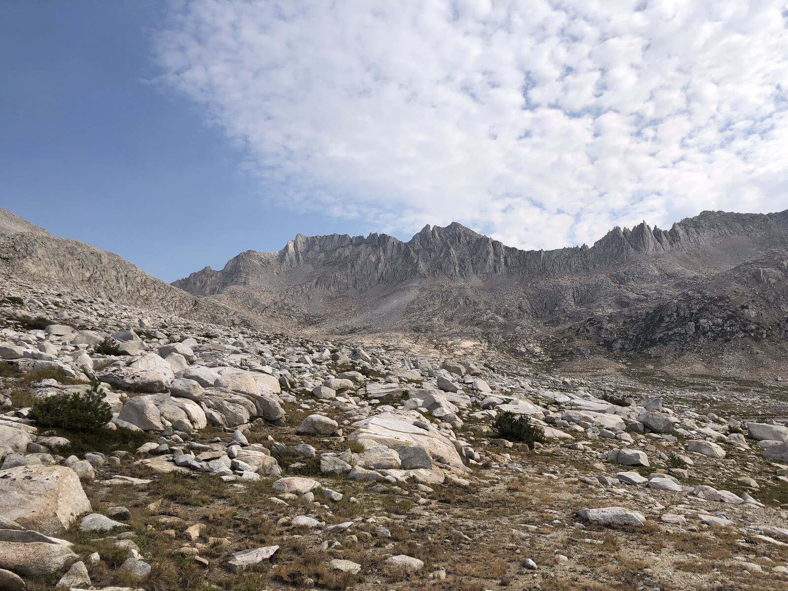 Rocky alpine basin with mountains and minimal vegetation