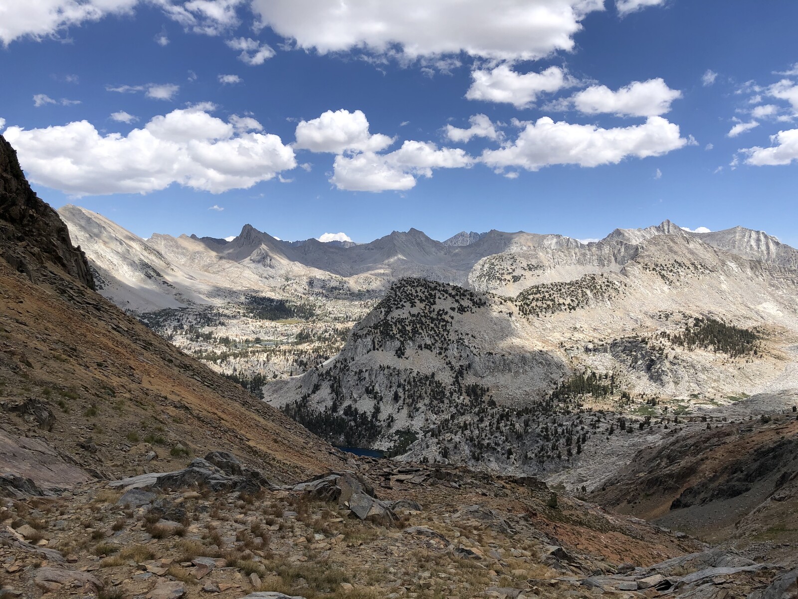 High alpine basin with multiple peaks and glaciated terrain